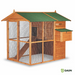 Wooden bird house with green roof and nesting box.