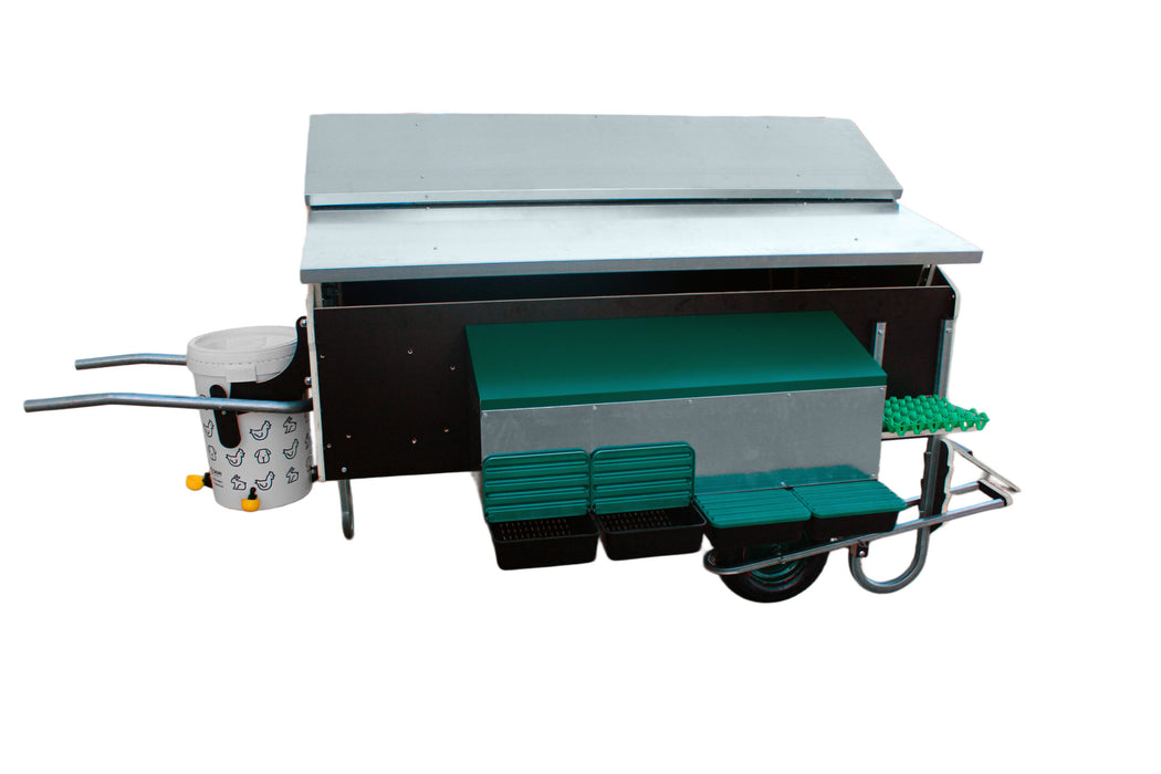 Mobile chicken house with wheels, handles, and egg collection system.