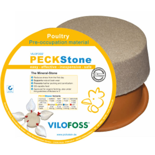 A round, grey peck stone on a brown dish with poultry product information.